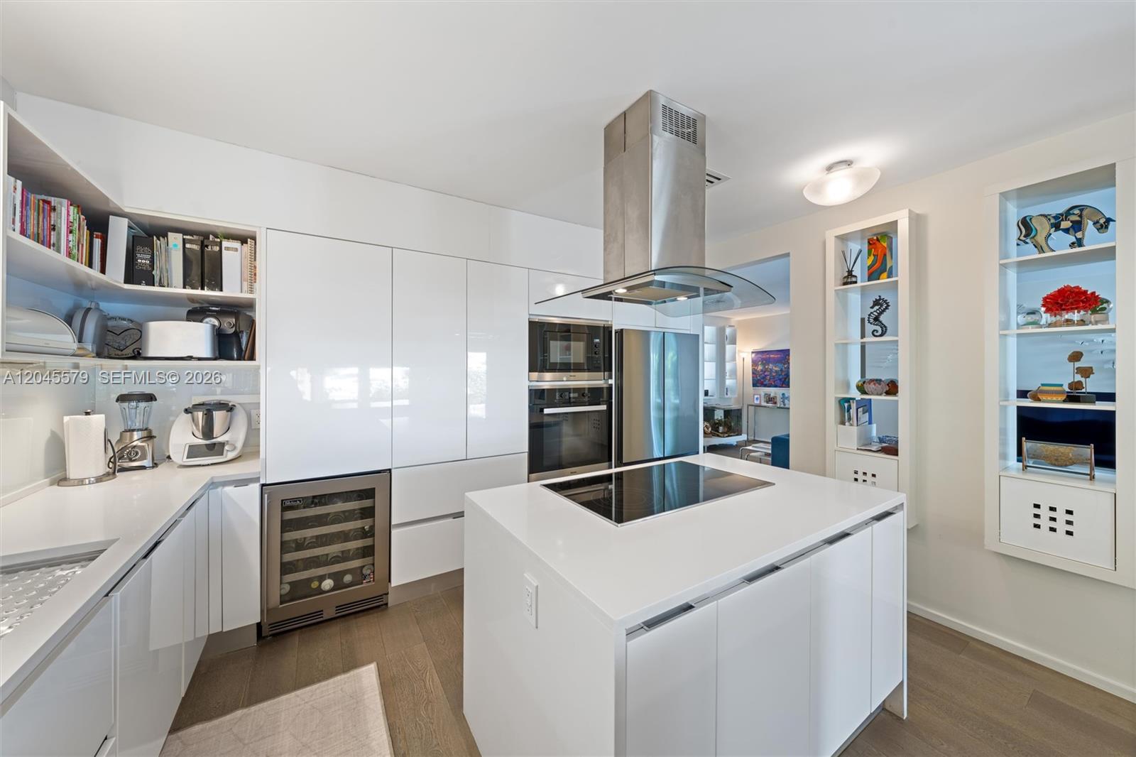 12944 Banyan Road North Miami, FL 33181 - Photo 9 of 26 a kitchen with stainless steel appliances granite countertop a sink and a stove
