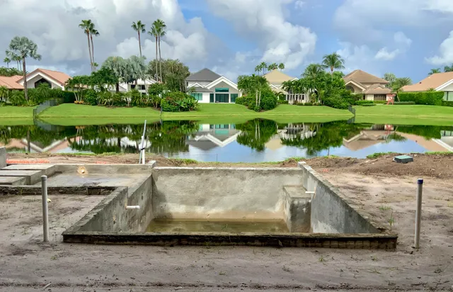 a view of a swimming pool and a yard