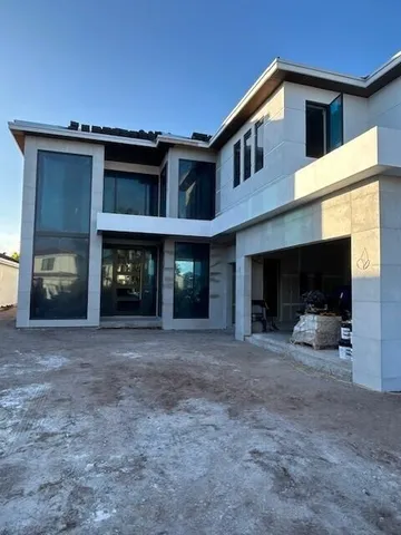 a view of a hallway with windows