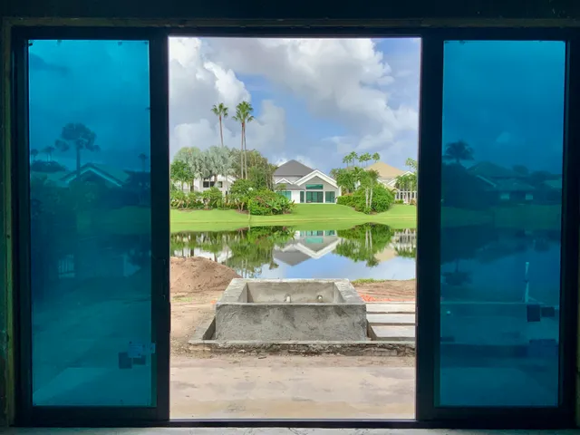 a view of a porch with a floor to ceiling windows