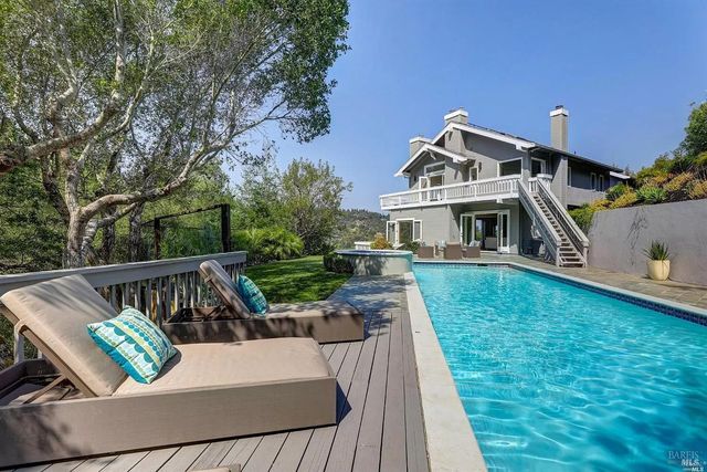 a view of house with outdoor seating space