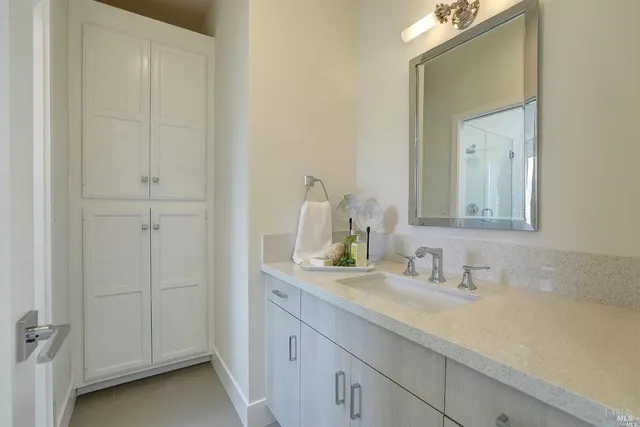 a bathroom with a sink and a mirror
