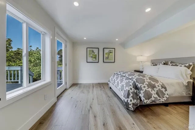 a bedroom with bed and window