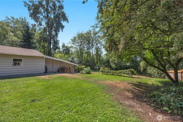a backyard of a house with lots of green space
