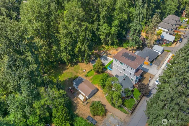 an aerial view of house with yard