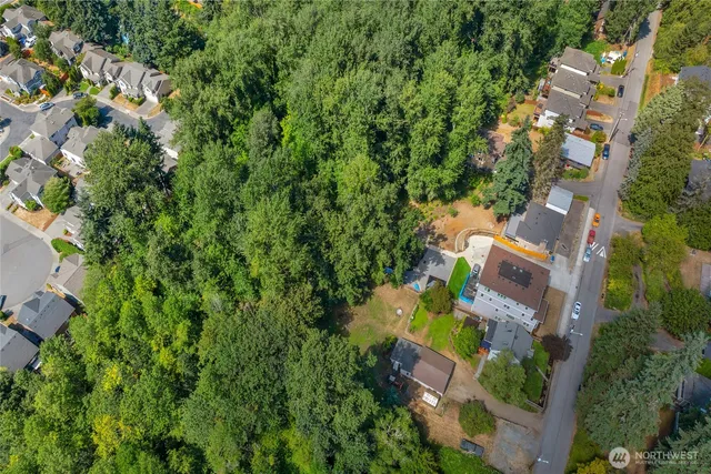 an aerial view of a house with a yard