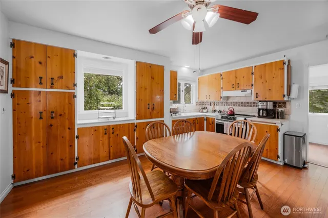 a view of a dining room with furniture window and outside view