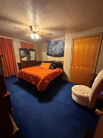 a bed sitting in a room next to a window