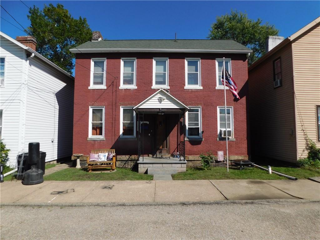9 Church Street Dunbar, PA 15431 - Photo 2 of 23 a front view of a house