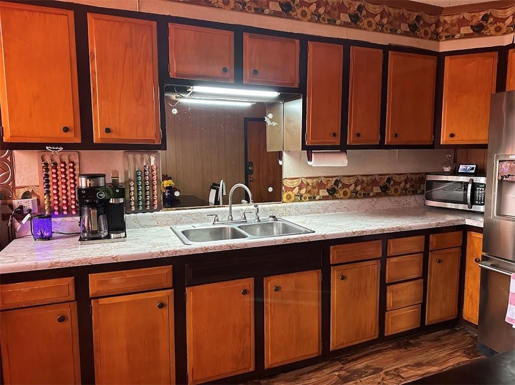 9 Church Street Dunbar, PA 15431 - Photo 21 of 23 a kitchen with stainless steel appliances granite countertop wooden cabinets a sink and dishwasher