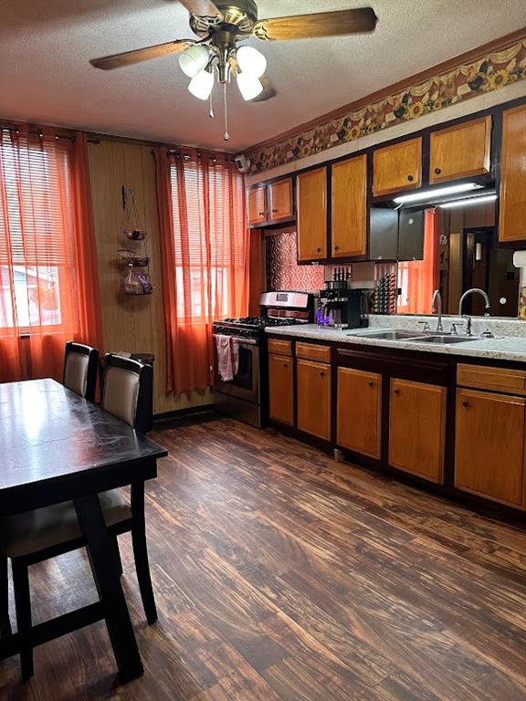 9 Church Street Dunbar, PA 15431 - Photo 23 of 23 a kitchen with stainless steel appliances granite countertop a sink dishwasher a stove dining table and chairs with wooden floor