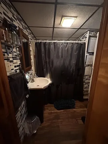 a bathroom with a sink and mirror