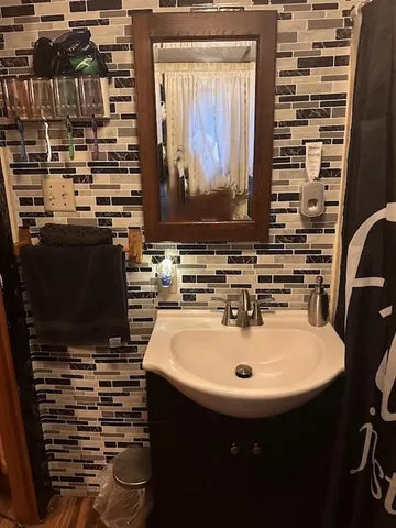 a bathroom with a sink and a mirror
