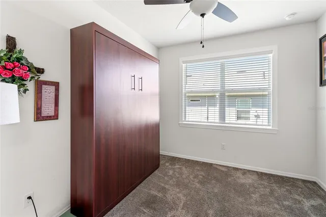 a kitchen with counter space appliances and wooden floor