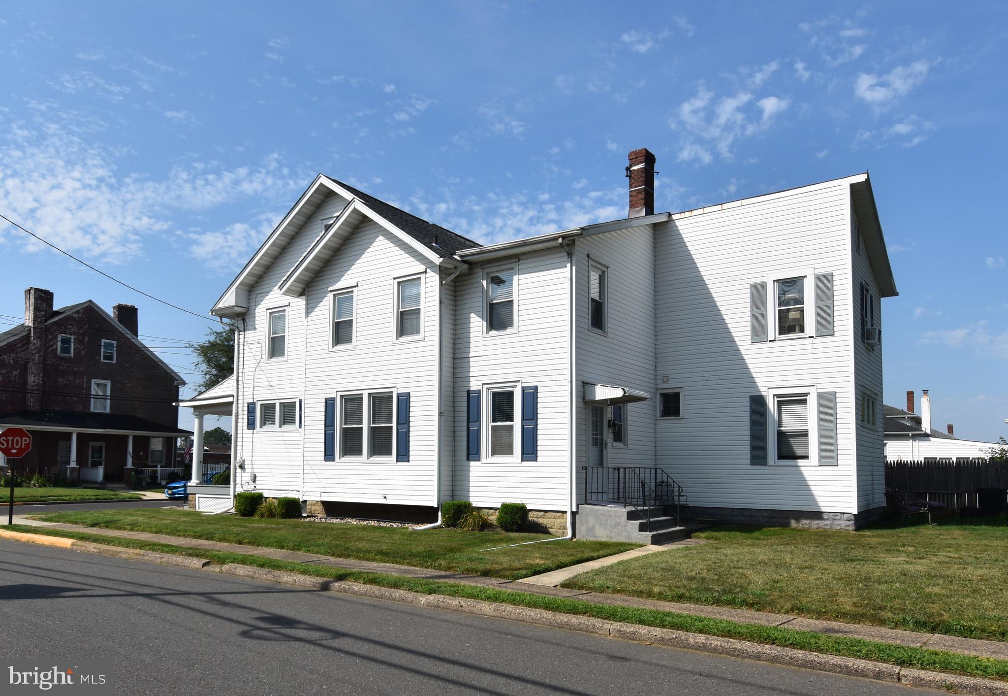 301 Conover Street Burlington, NJ 08016 - Photo 3 of 24 a front view of a house with a yard
