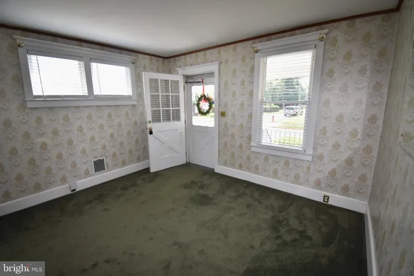 an empty room with windows