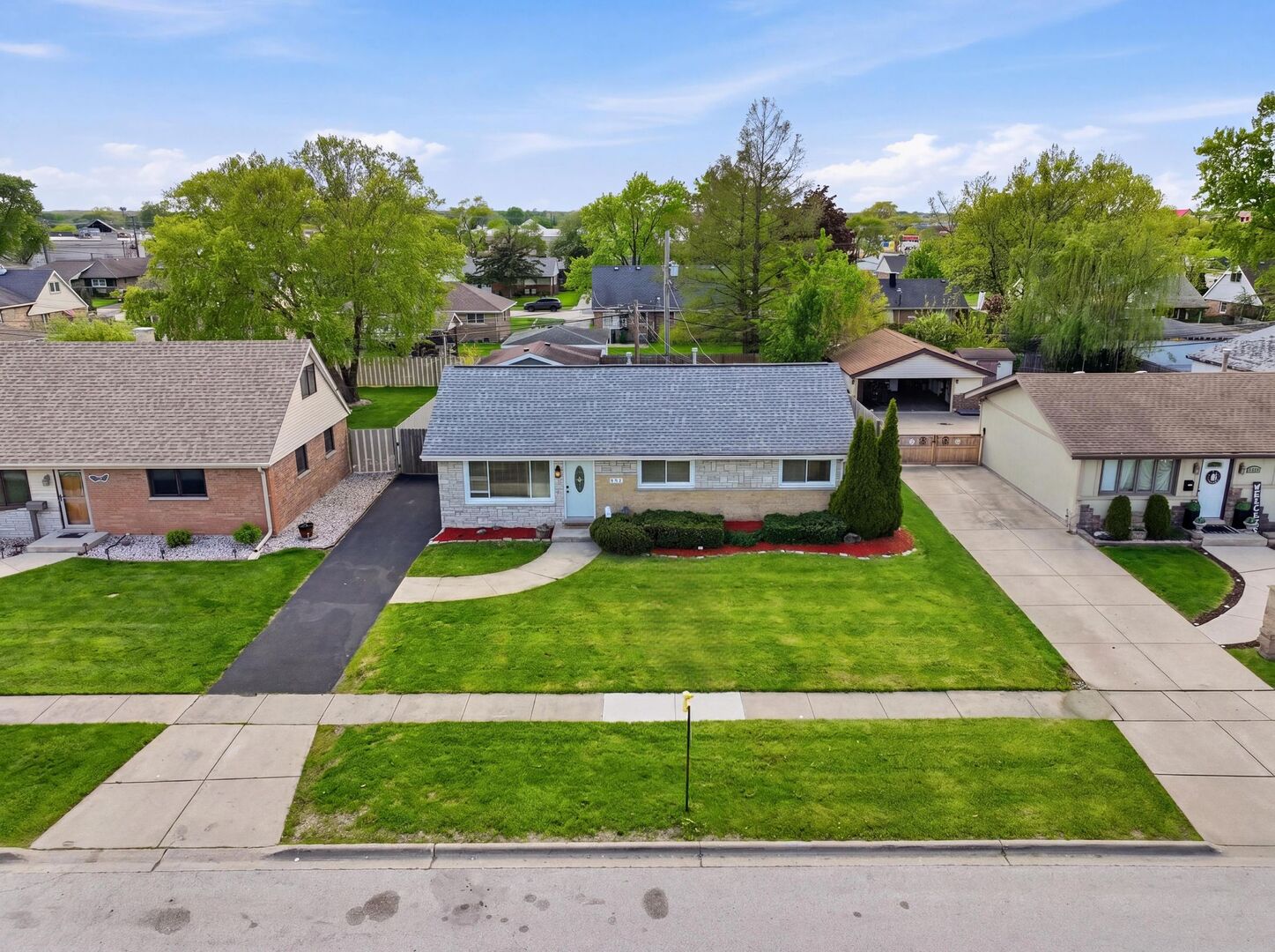 8718 Cranbrook Lane Bridgeview, IL 60455 - Photo 21 of 24 a view of a house with a yard