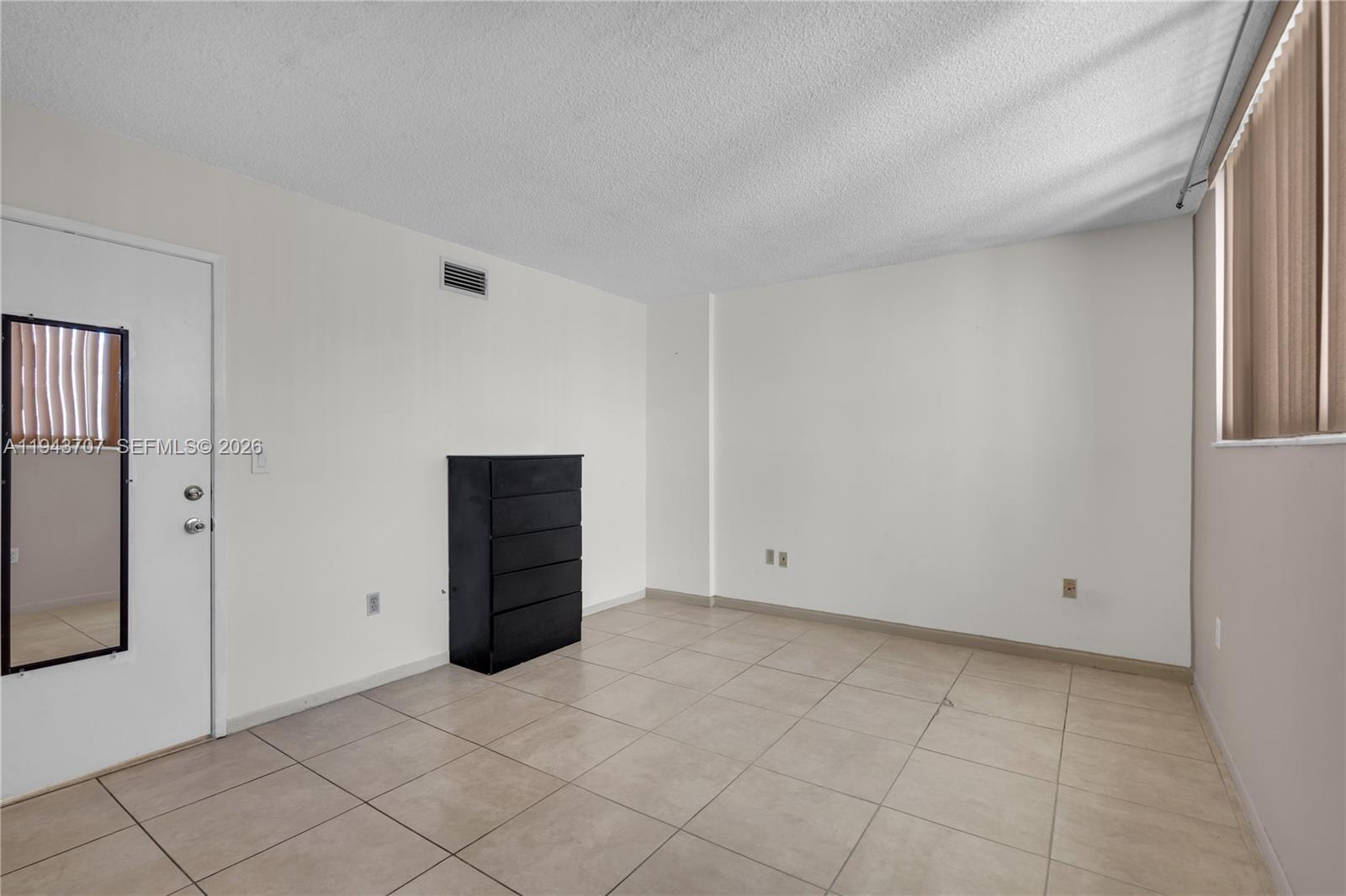 8050 Northwest 8th Street, Unit 305 Miami, FL 33126 - Photo 12 of 25 a view of an empty room