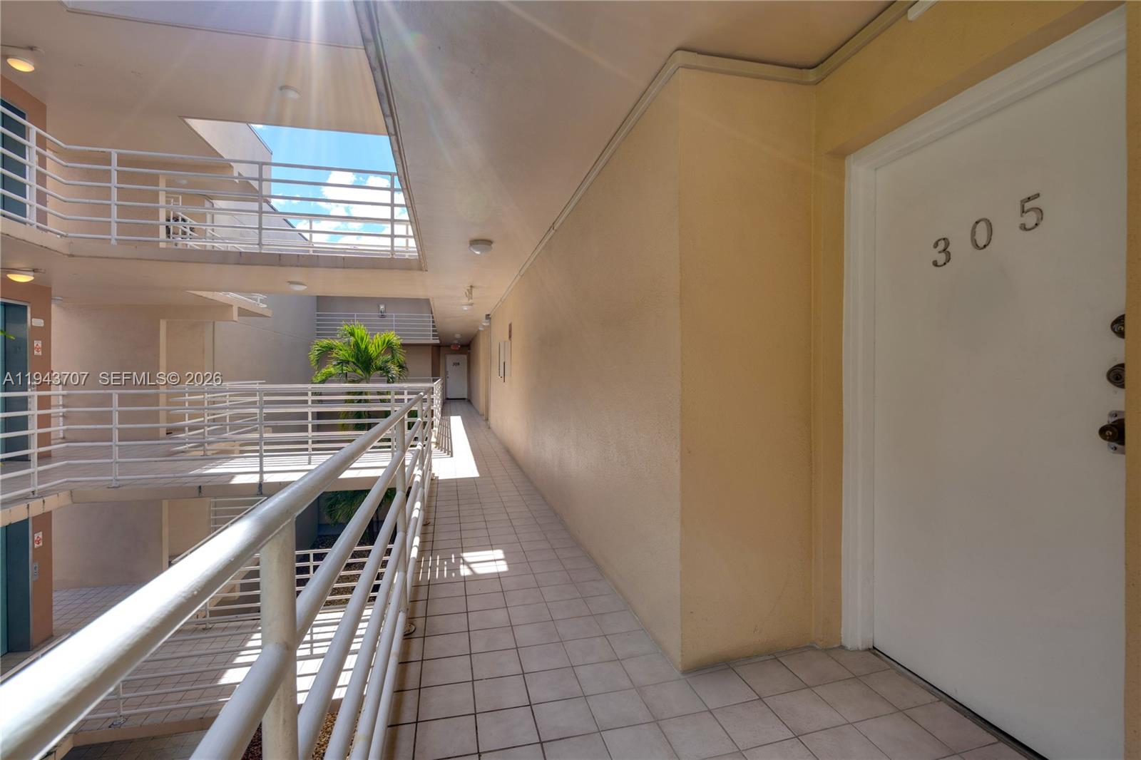 8050 Northwest 8th Street, Unit 305 Miami, FL 33126 - Photo 14 of 25 a view of entryway and kitchen