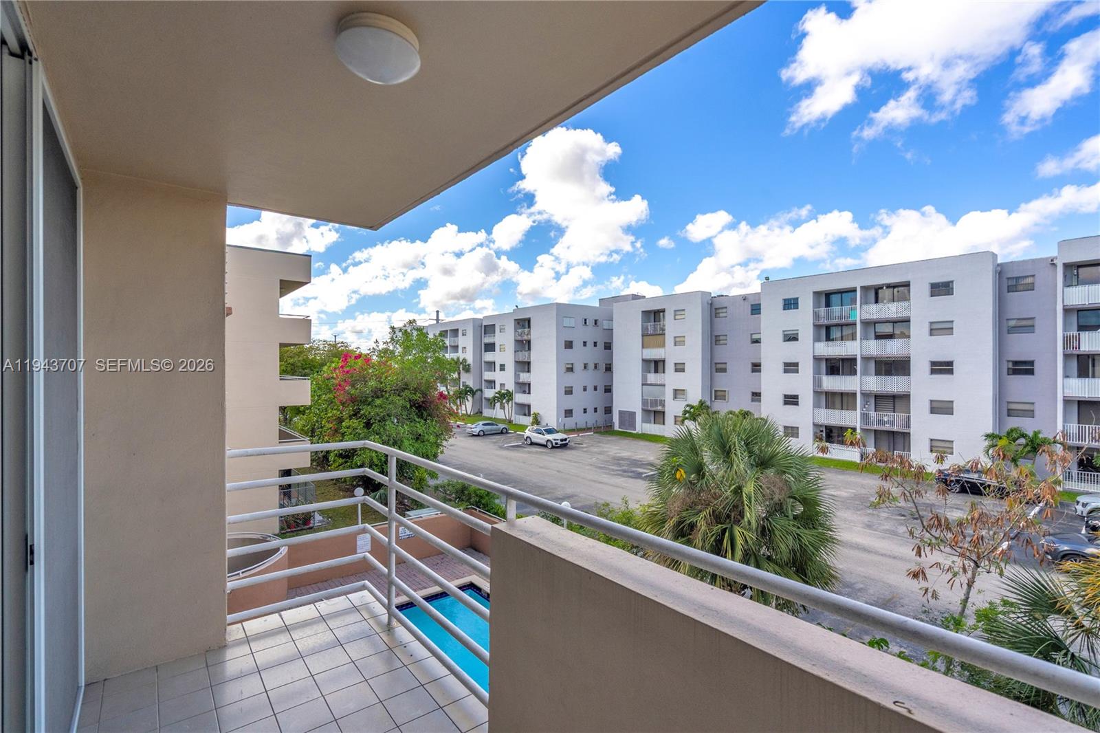 8050 Northwest 8th Street, Unit 305 Miami, FL 33126 - Photo 16 of 25 a view of a balcony with potted plants