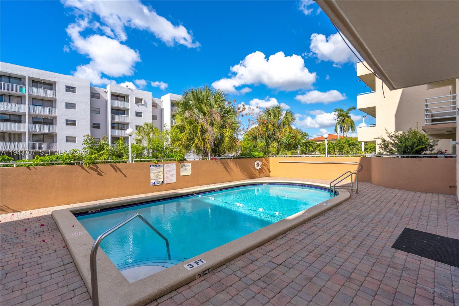 8050 Northwest 8th Street, Unit 305 Miami, FL 33126 - Photo 20 of 25 a view of swimming pool with a patio