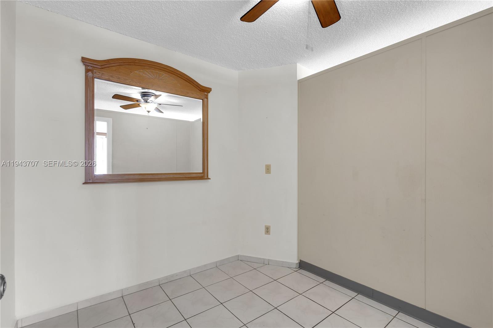 8050 Northwest 8th Street, Unit 305 Miami, FL 33126 - Photo 9 of 25 an empty room with windows