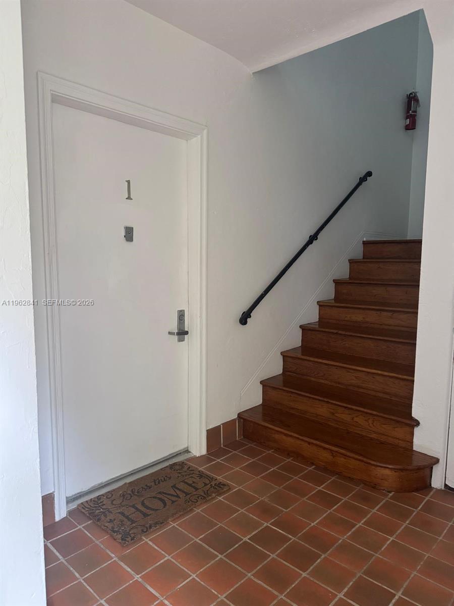 6941 Bay Drive, Unit A1 Miami Beach, FL 33141 - Photo 3 of 10 a view of entryway with wooden floor and stairs