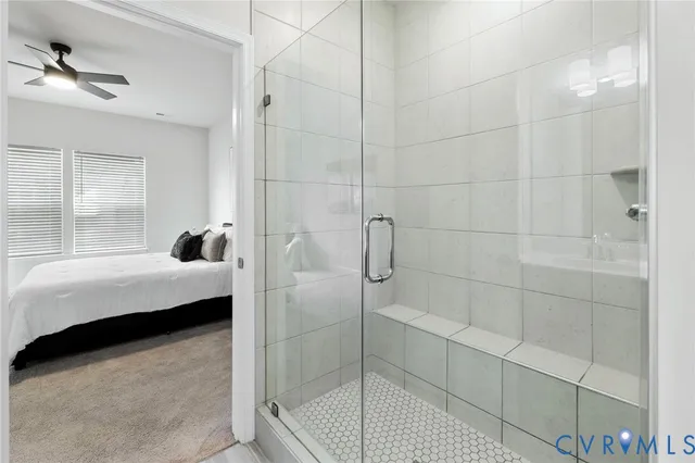 a bedroom with a bed and a shower