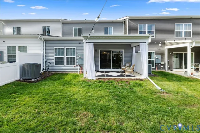 a view of a house with a yard and plants
