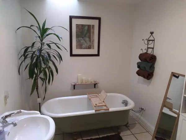 a view of a livingroom with furniture and a flat screen tv