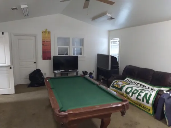 a room with furniture and a flat screen tv