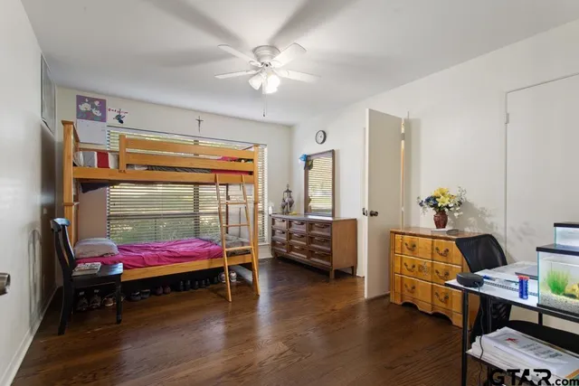 a bedroom with bed and a window