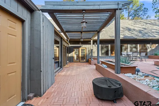 a room with wooden floor and furniture