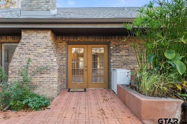 a view of a wooden door of the house
