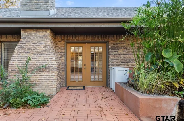 a view of a wooden door of the house