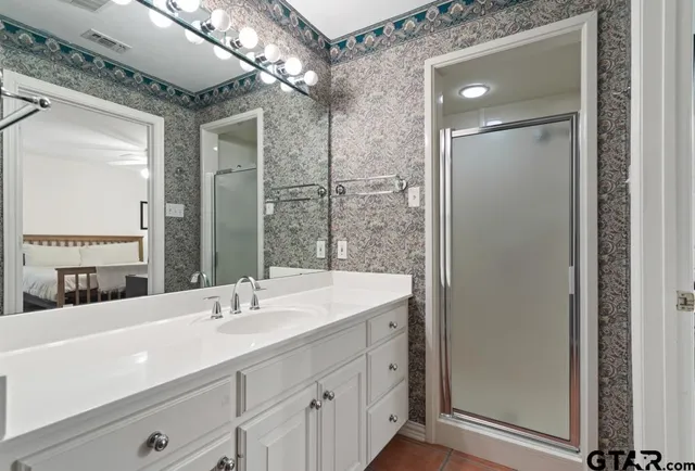 a bathroom with a sink and a mirror