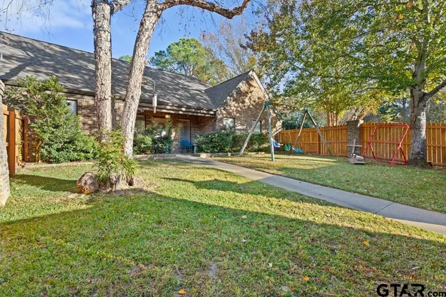 a view of a playground with basketball court