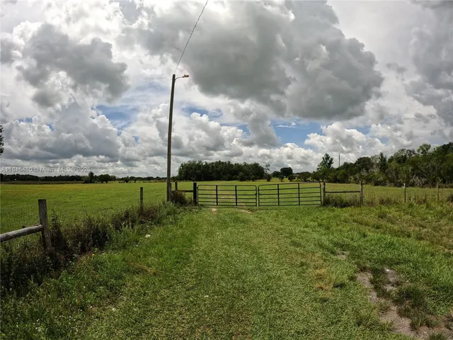 a view of a golf course with a big yard