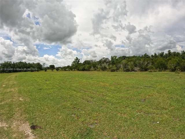 a view of a field with clear sky