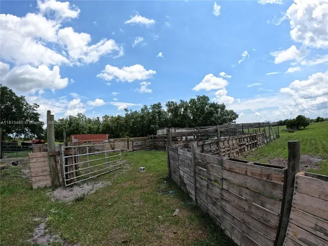 a view of a garden with sitting area