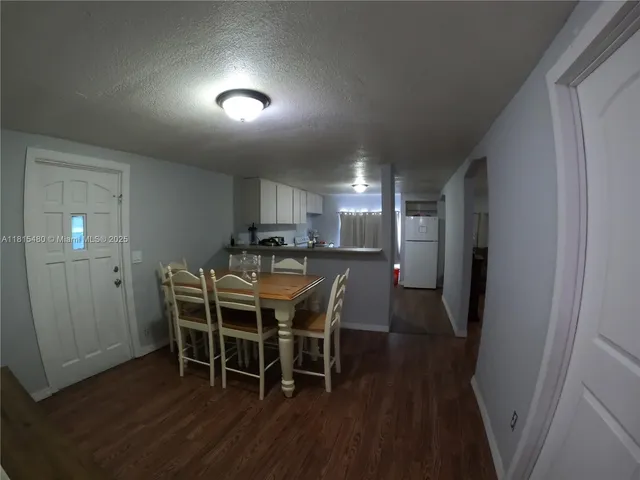 a bedroom with a bed and a table