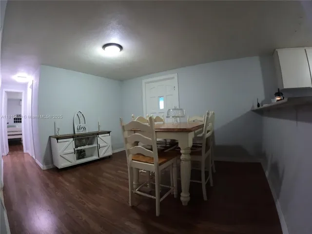 a view of room with stairs and a hallway