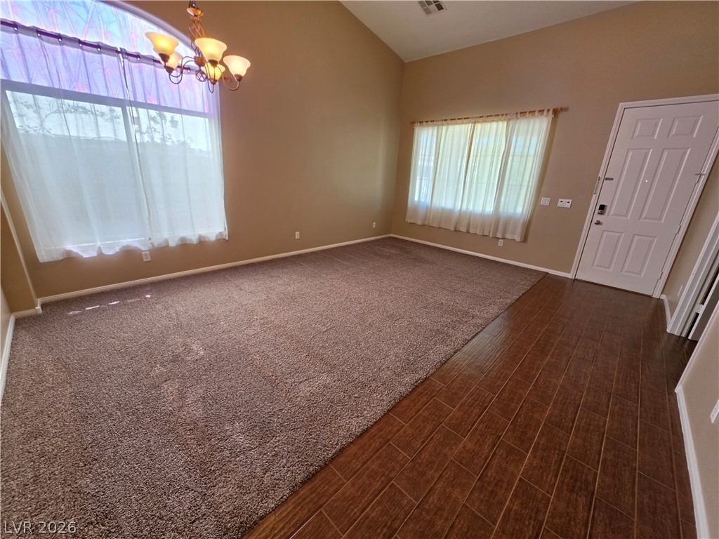 209 Opera House Street Henderson, NV 89012 - Photo 16 of 45 Vaulted ceilings and arched window detail elevate this welcoming entry space.