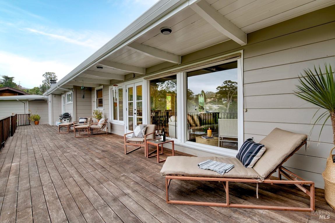 22 Broadview Drive San Rafael, CA 94901 - Photo 1 of 1 a view of a patio with table and chairs and wooden floor