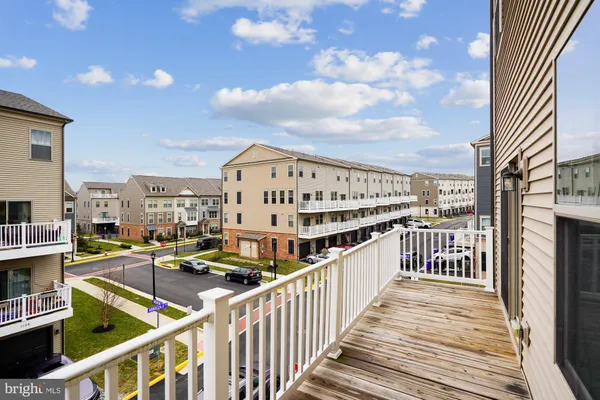 a view of a balcony with wooden floor