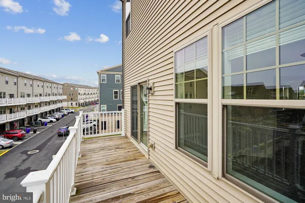 a view of a balcony with wooden floor