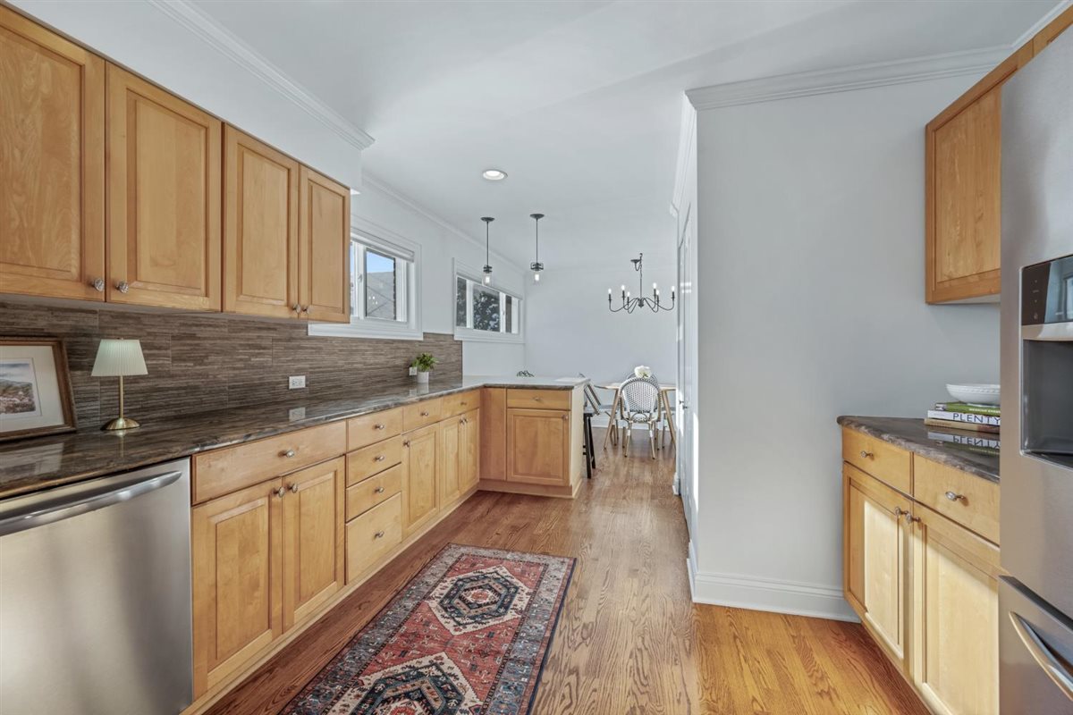 1821 George Court Glenview, IL 60025 - Photo 10 of 24 a kitchen with granite countertop a sink stove and cabinets