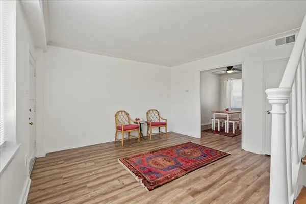 a living room with furniture and a rug