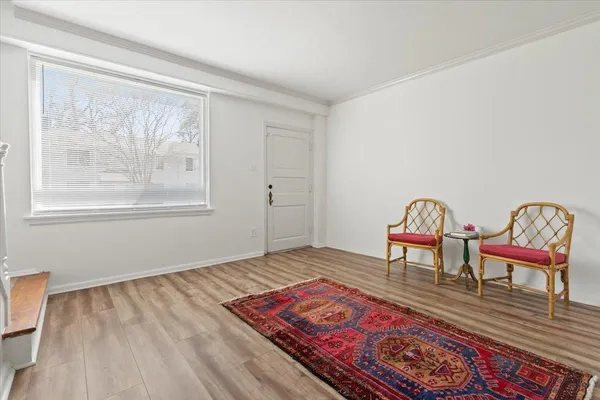 a living room with furniture and a rug