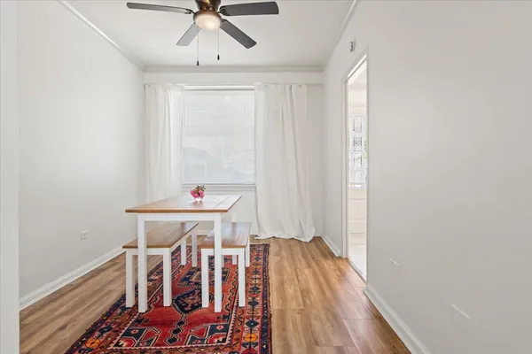 a view of room with wooden floor